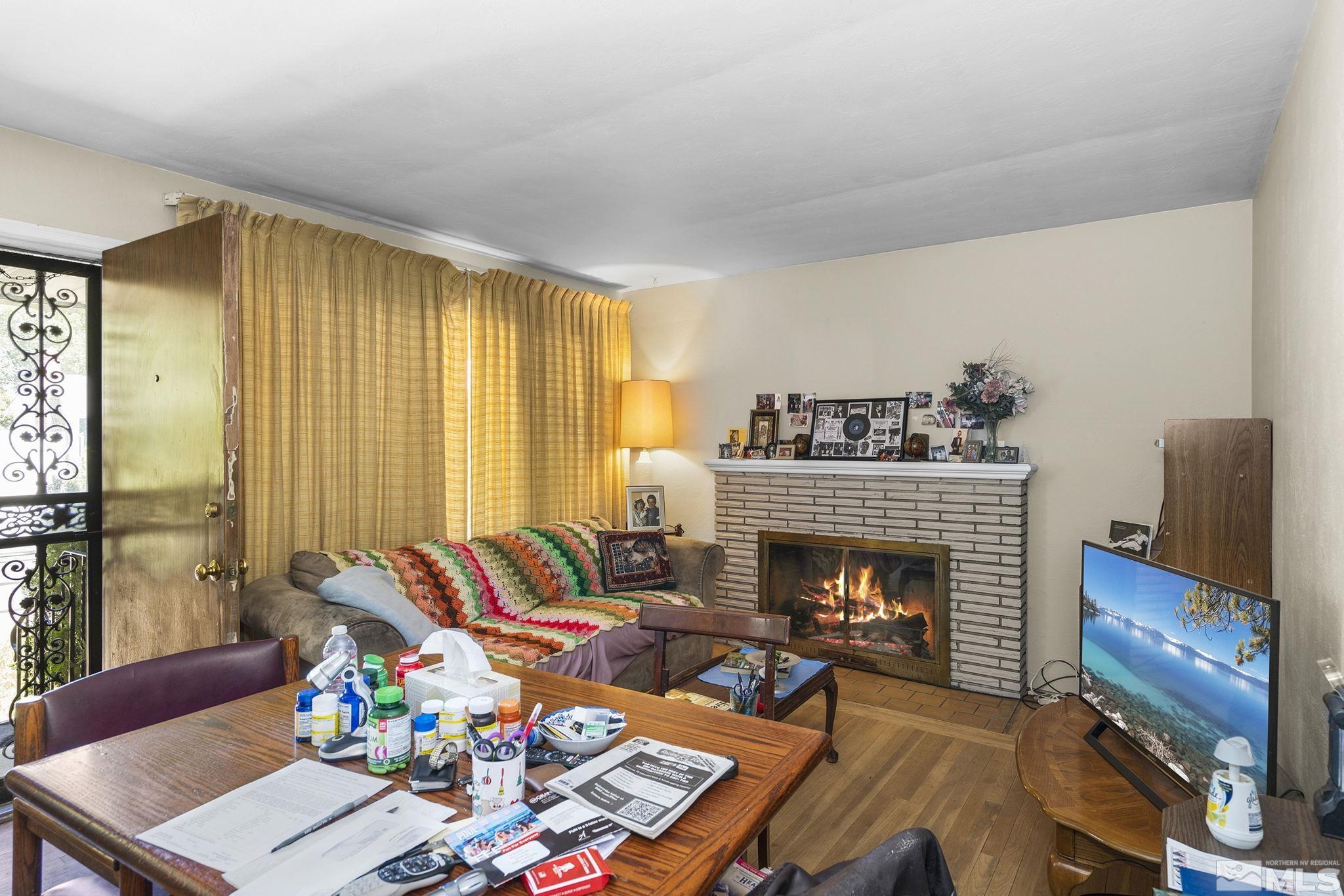 655 Belgrave Avenue Reno, NV 89502 - Photo 4 of 17 a living room with furniture and a fireplace