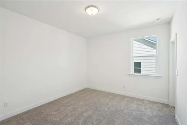 a view of an empty room with a sink