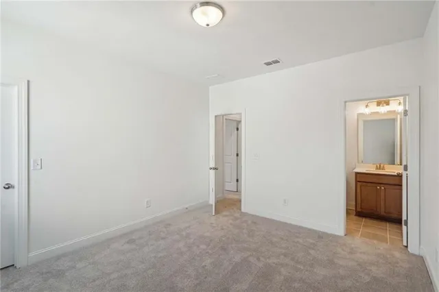 a bathroom with a bathtub a sink a toilet and a mirror