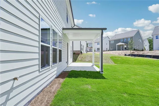 a view of a house with a yard