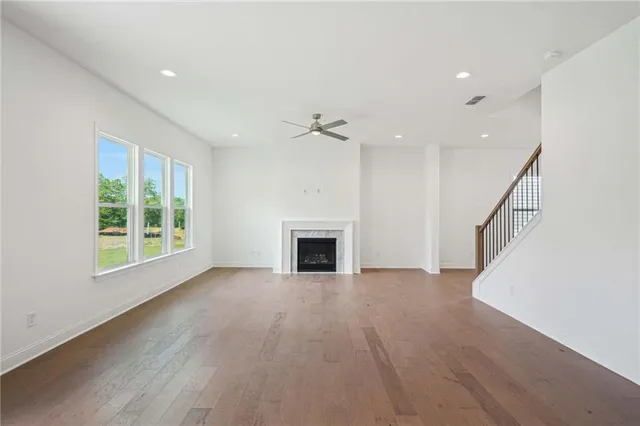 a view of a livingroom with an empty space and a fireplace