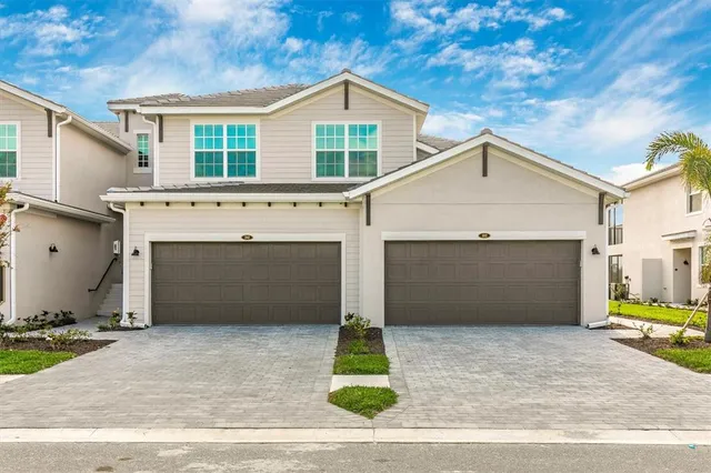 a front view of a house with garage