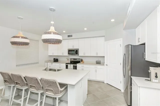 a living room with fireplace furniture and a flat screen tv