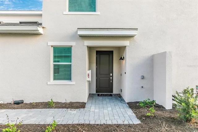 a living room with furniture a sink and a fireplace