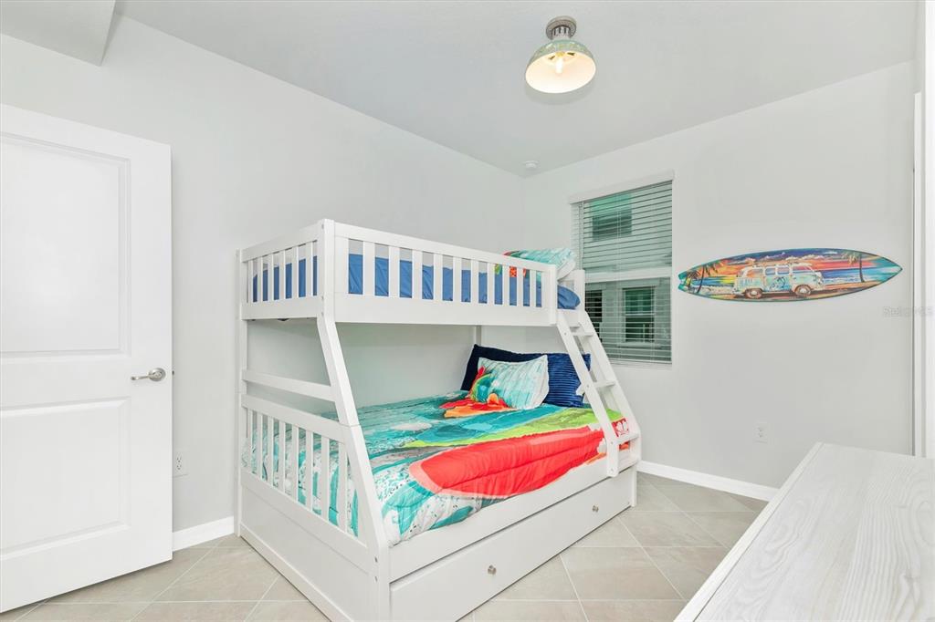 12625 Radiance Court, Unit 102 Venice, FL 34293 - Photo 42 of 99 a bedroom with furniture and a window