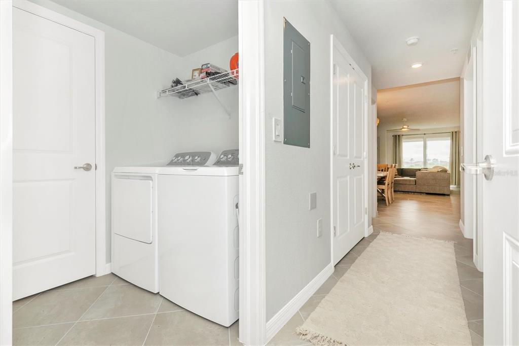 12625 Radiance Court, Unit 102 Venice, FL 34293 - Photo 44 of 99 a view of a hallway with closet and a livingroom view