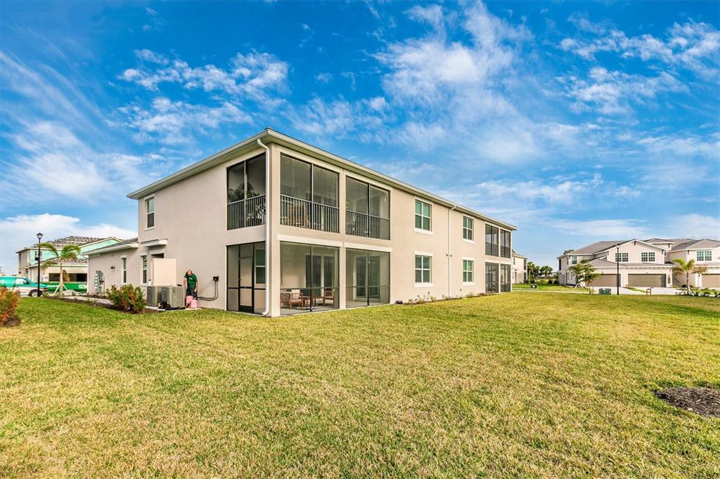 12625 Radiance Court, Unit 102 Venice, FL 34293 - Photo 47 of 99 a front view of a house with a yard
