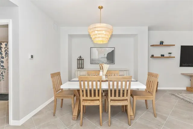 a kitchen with white cabinets and a stove