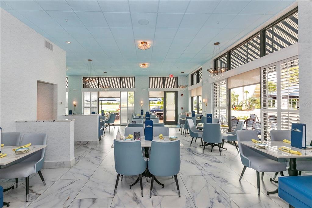 12625 Radiance Court, Unit 102 Venice, FL 34293 - Photo 97 of 99 a view of a dining room with furniture window and outside view