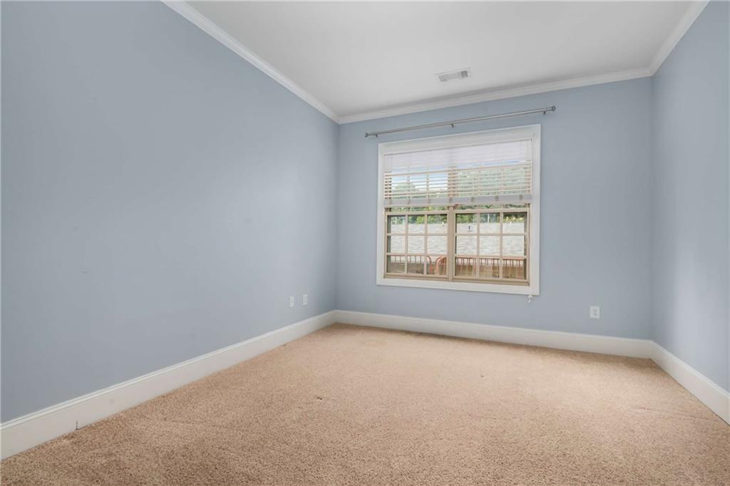 1055 Piedmont Avenue Northeast, Unit 114 Atlanta, GA 30309 - Photo 14 of 40 an empty room with a window
