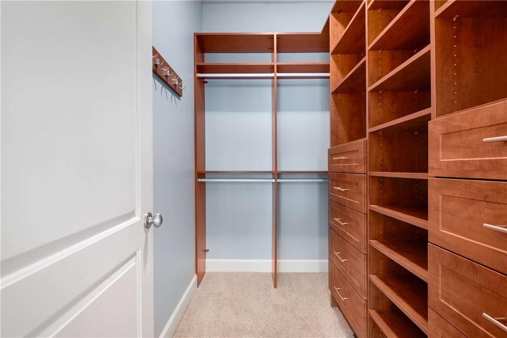 1055 Piedmont Avenue Northeast, Unit 114 Atlanta, GA 30309 - Photo 16 of 40 a view of walk in closet with empty racks