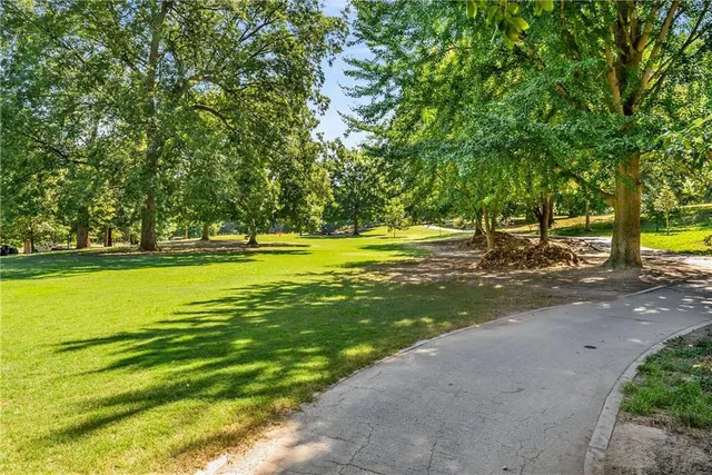 a view of a green field with clear sky