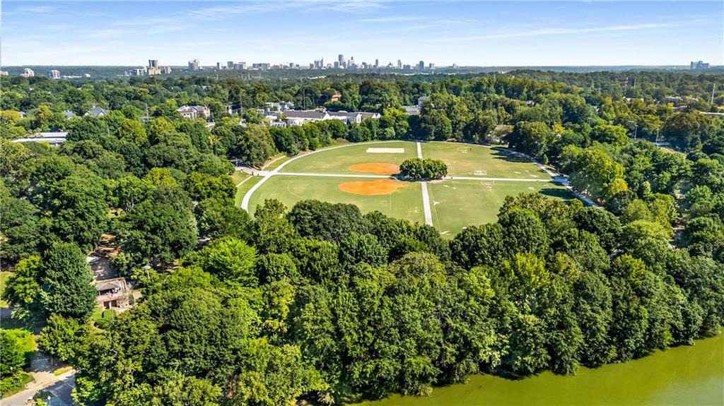 1055 Piedmont Avenue Northeast, Unit 114 Atlanta, GA 30309 - Photo 39 of 40 an aerial view of residential houses with outdoor space and trees