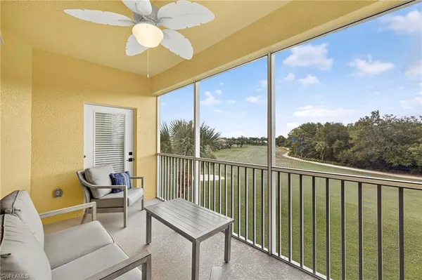 a view of a balcony with furniture