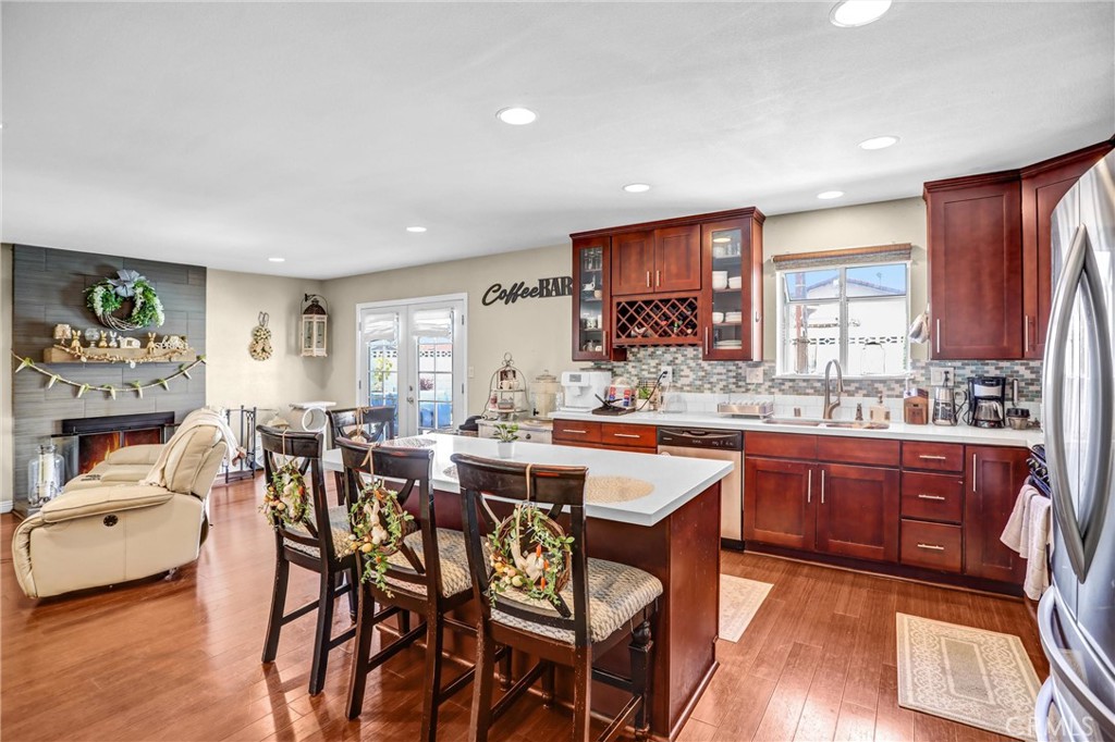 6280 Kinlock Avenue Rancho Cucamonga, CA 91737 - Photo 12 of 24 a view of a dining room with furniture window and wooden floor