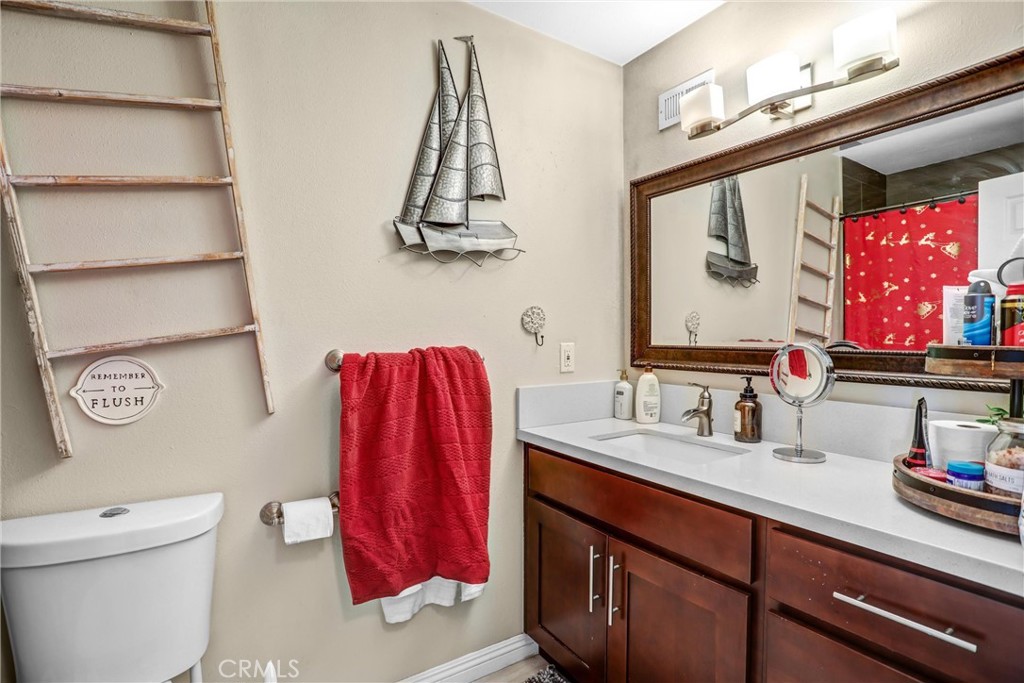 6280 Kinlock Avenue Rancho Cucamonga, CA 91737 - Photo 14 of 24 a bathroom with a sink and a mirror