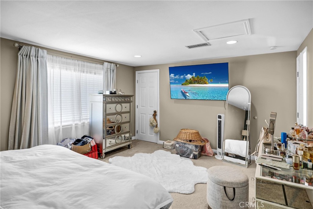 6280 Kinlock Avenue Rancho Cucamonga, CA 91737 - Photo 19 of 24 a bedroom with bed and a large mirror