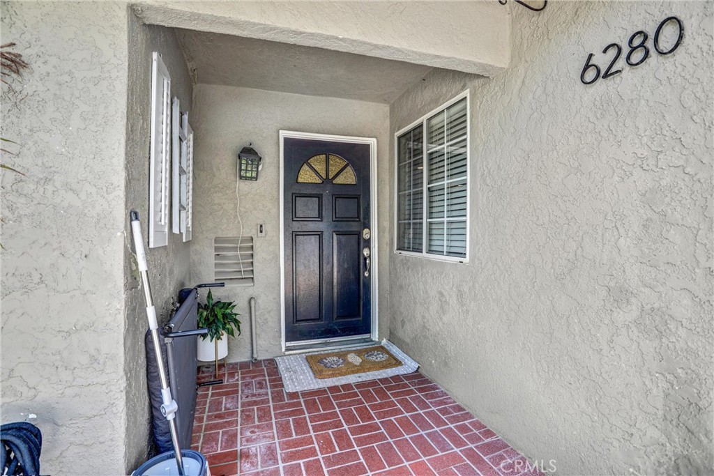 6280 Kinlock Avenue Rancho Cucamonga, CA 91737 - Photo 5 of 24 a front view of a house with a potted plant