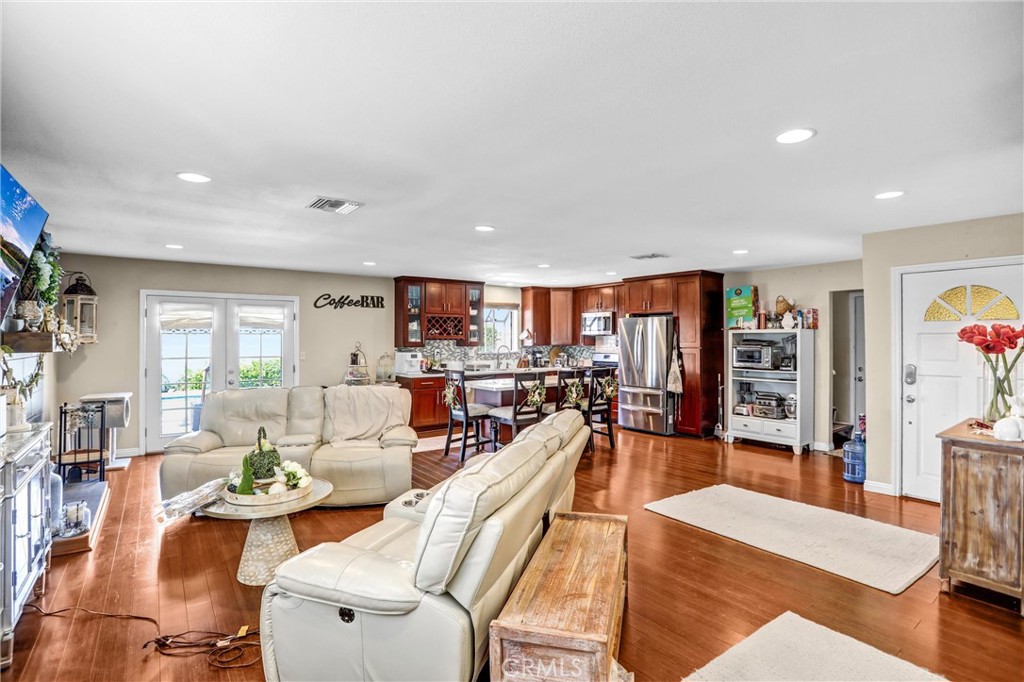6280 Kinlock Avenue Rancho Cucamonga, CA 91737 - Photo 9 of 24 a living room with furniture kitchen view and a large window