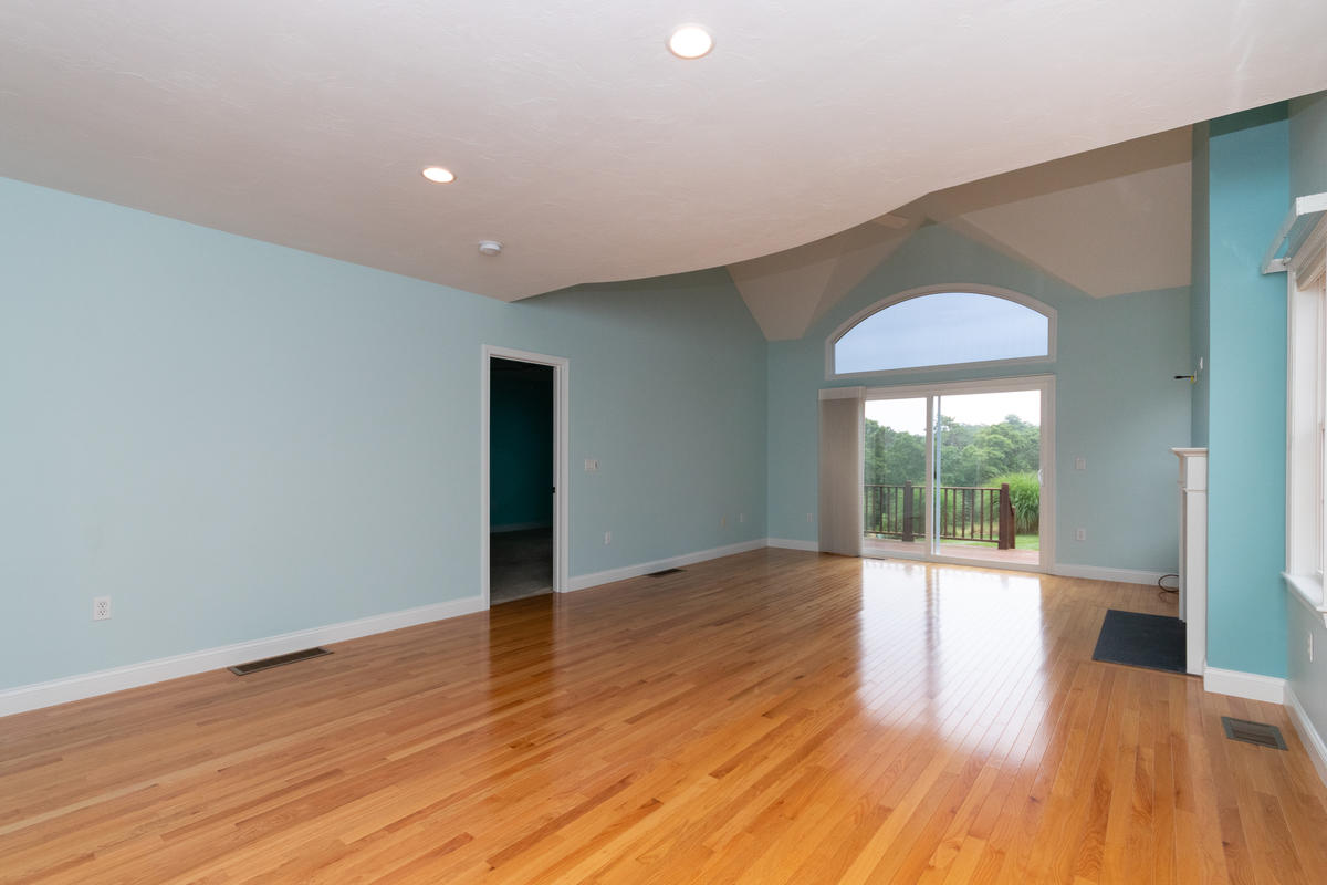20 Prestwick Road Bourne, MA 02532 - Photo 12 of 29 a view of an empty room with wooden floor and a window