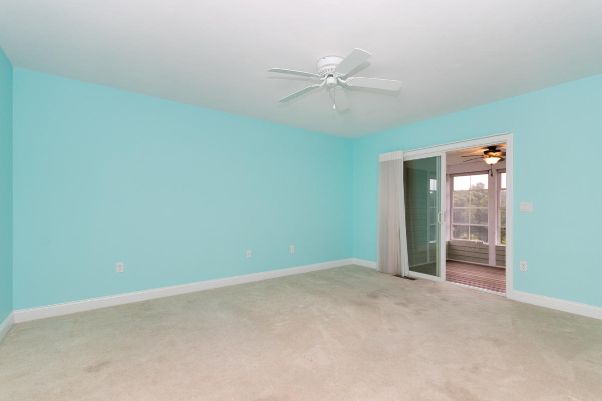 20 Prestwick Road Bourne, MA 02532 - Photo 15 of 29 an empty room with closet and a chandelier fan