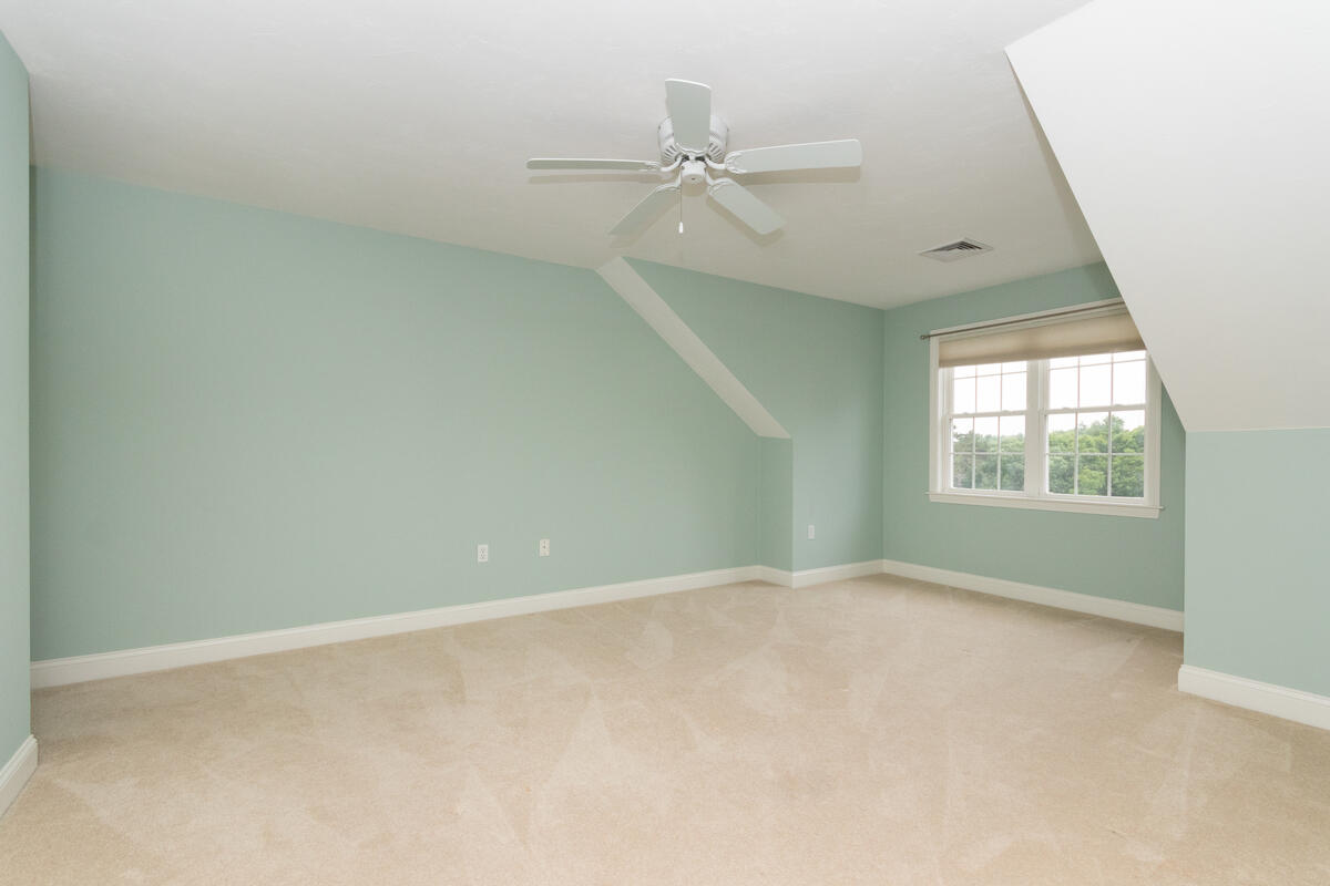 20 Prestwick Road Bourne, MA 02532 - Photo 23 of 29 an empty room with a window and a fan