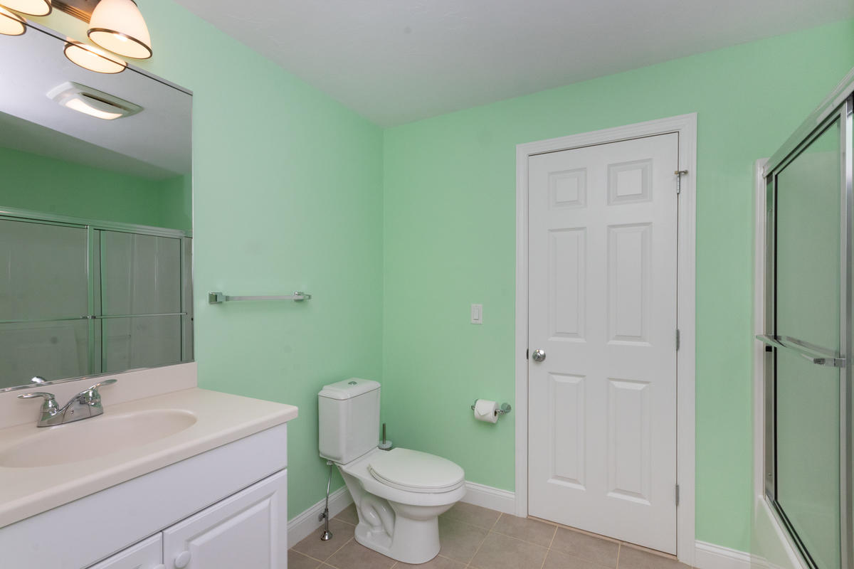 20 Prestwick Road Bourne, MA 02532 - Photo 24 of 29 a bathroom with a toilet sink and mirror