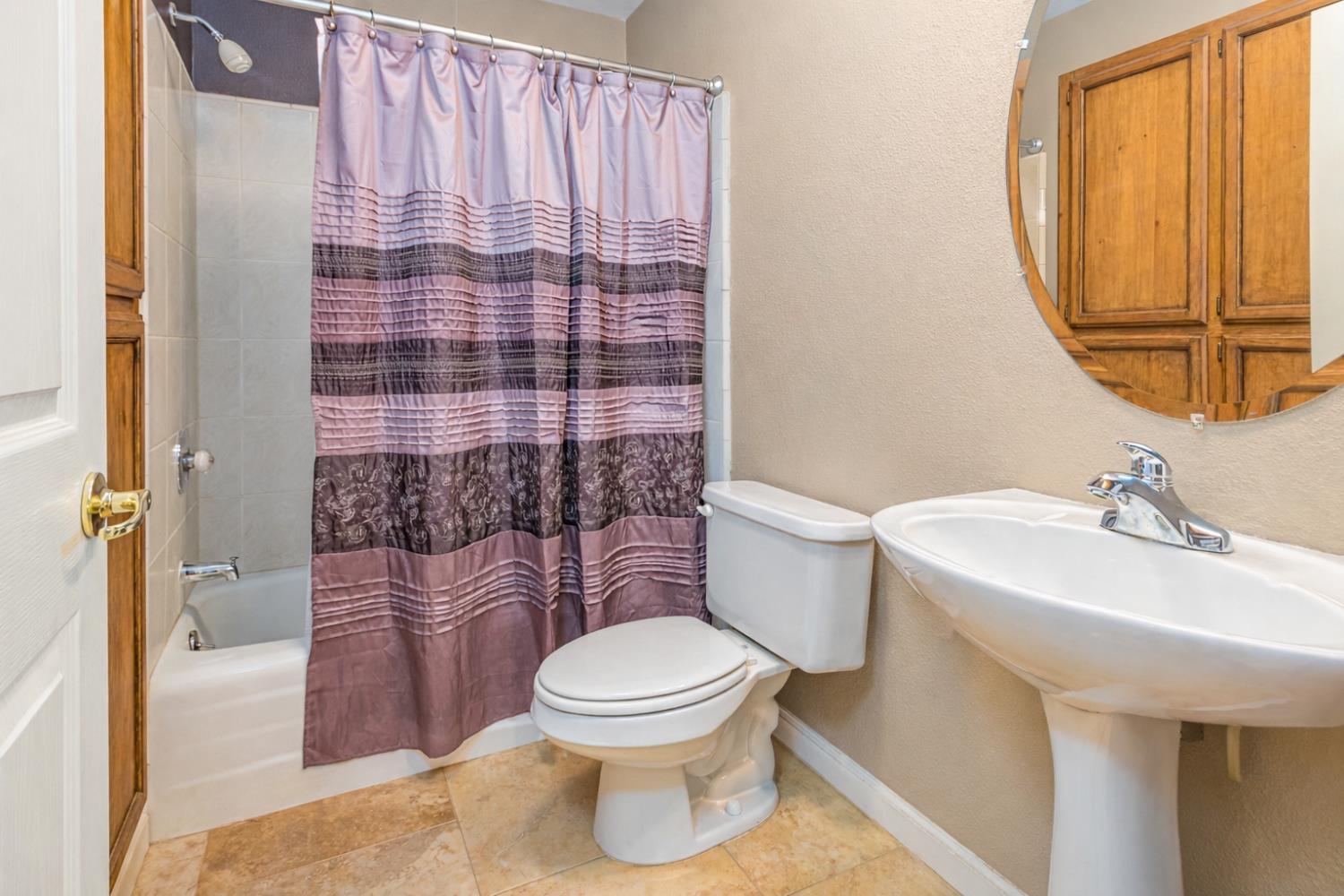 9290 Cramer Road Auburn, CA 95602 - Photo 31 of 67 a bathroom with a sink a toilet and shower