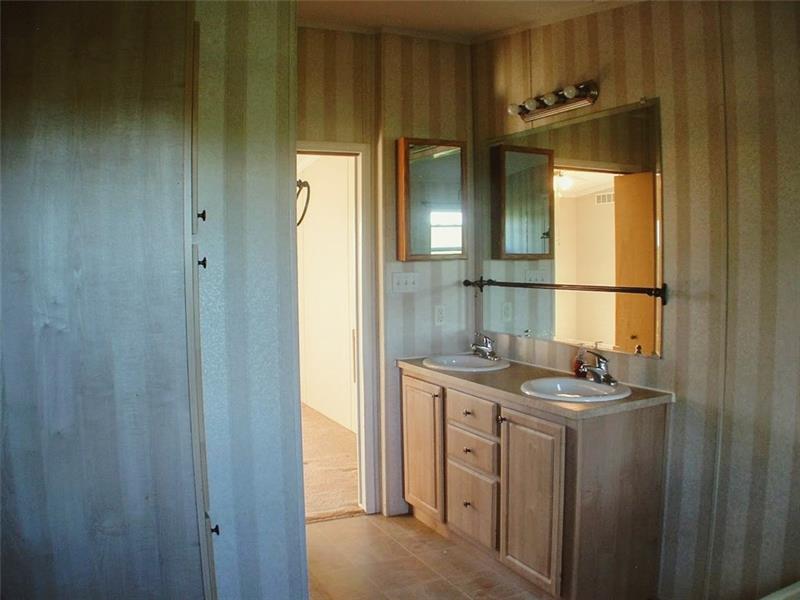 429 Burnsville Ridge Road Claysville, PA 15323 - Photo 11 of 21 The 8x13 master bath is equipped with a double-bowl vanity plus a linen closet and access to the 13x5 walk-in closet.