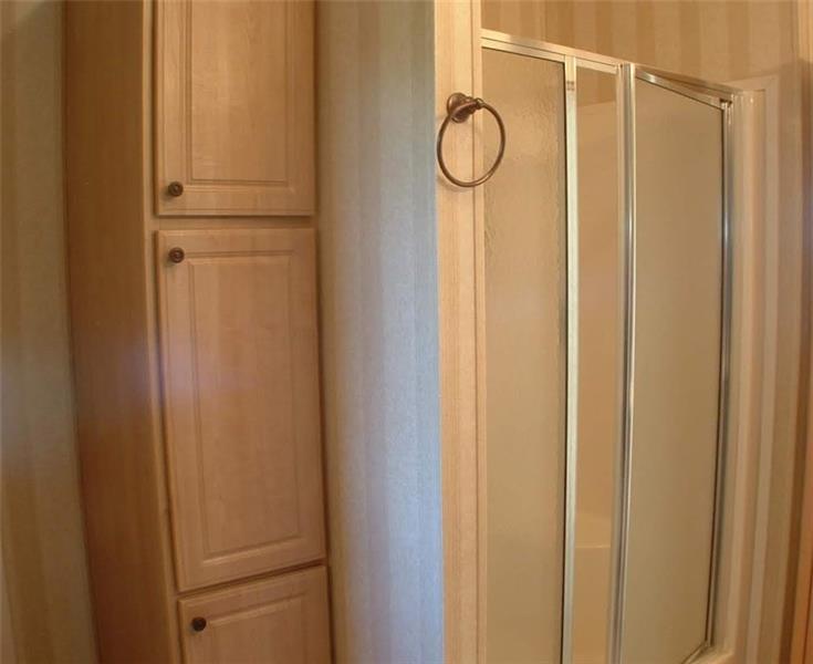 429 Burnsville Ridge Road Claysville, PA 15323 - Photo 12 of 21 Master bath shower and linen storage cabinet. Just to the left (out of camera frame) is the door for the walk-in closet.