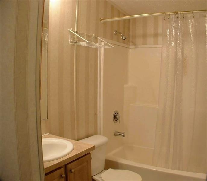 429 Burnsville Ridge Road Claysville, PA 15323 - Photo 15 of 21 The main bath is directly across from Bedroom 2 and offers a tub/shower combo and a vanity for storage.
