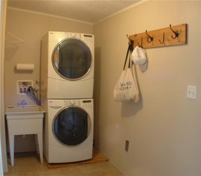 429 Burnsville Ridge Road Claysville, PA 15323 - Photo 20 of 21 The roomy 8x12 entry/mud room doubles as the laundry and comes equipped with full size, stacked, high-efficiency washer and dryer.
