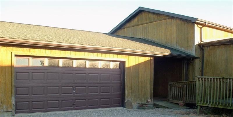 429 Burnsville Ridge Road Claysville, PA 15323 - Photo 4 of 21 Over sized 2 car garage is heated and has a man door opening onto the breezeway that is between the garage and the 2-story addition. The ramp leads onto the 10x22 main porch and sure is a convenience for moving and carrying or for those with mobility issues.