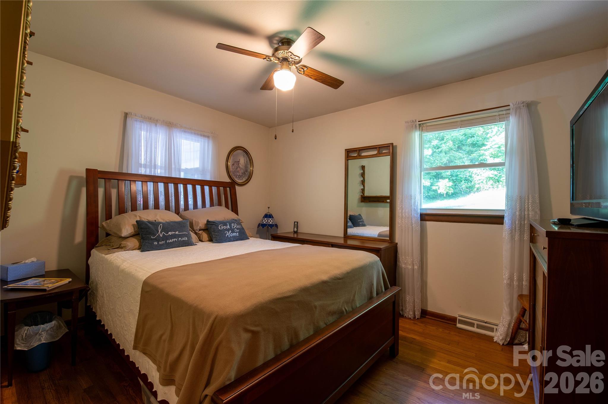 40 Double Island Road Burnsville, NC 28714 - Photo 26 of 38 a bedroom with a bed and a flat screen tv