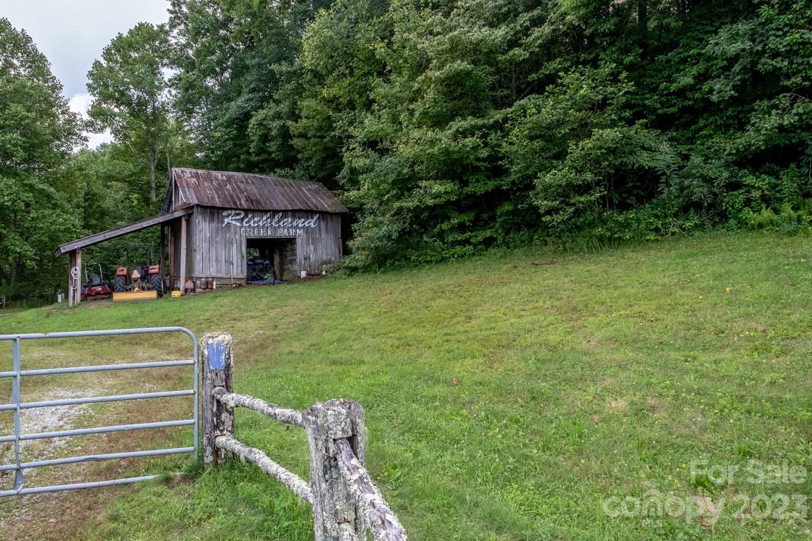 427 Quarry Road, Unit 22 Lake Toxaway, NC 28747 - Photo 14 of 21 a view of a house with a backyard