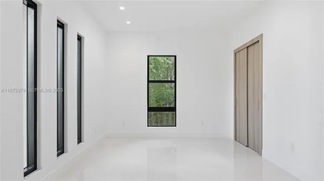 a view of an empty room and window