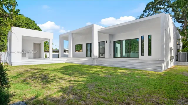 a view of a house with swimming pool and porch