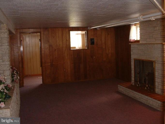 1601 Wilson Point Road Middle River, MD 21220 - Photo 12 of 17 a view of empty room with a fireplace