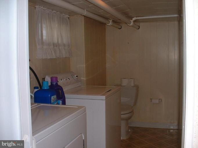 1601 Wilson Point Road Middle River, MD 21220 - Photo 14 of 17 a bathroom with a sink toilet and shower