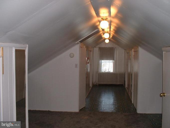 1601 Wilson Point Road Middle River, MD 21220 - Photo 15 of 17 a view of a hallway with a chandelier fan and a window