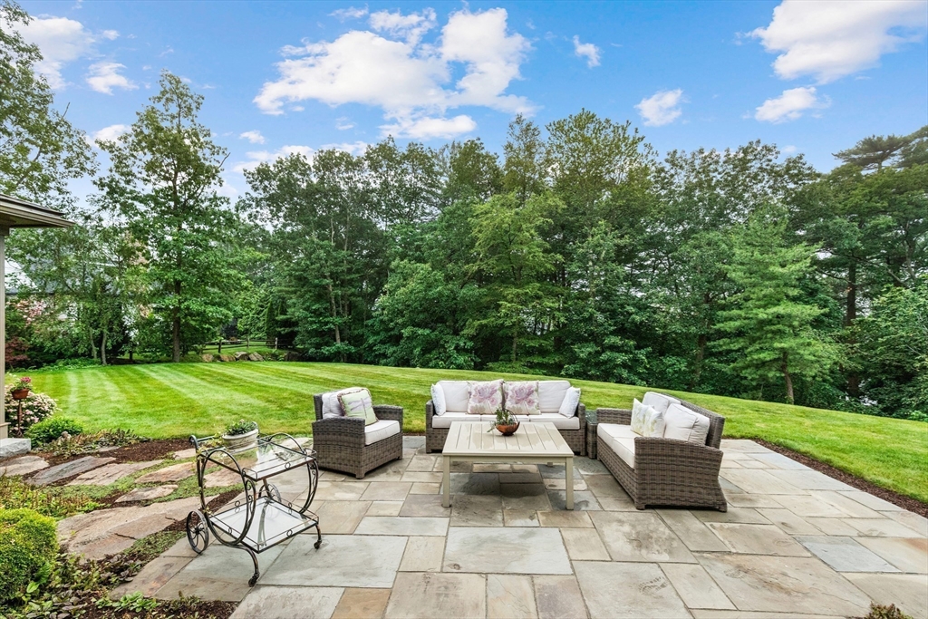 27 Whitehall Circle Beverly, MA 01915 - Photo 11 of 42 a view of a chairs and table in the garden