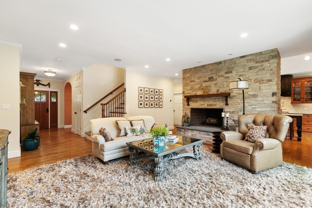 27 Whitehall Circle Beverly, MA 01915 - Photo 12 of 42 a living room with furniture and a fireplace