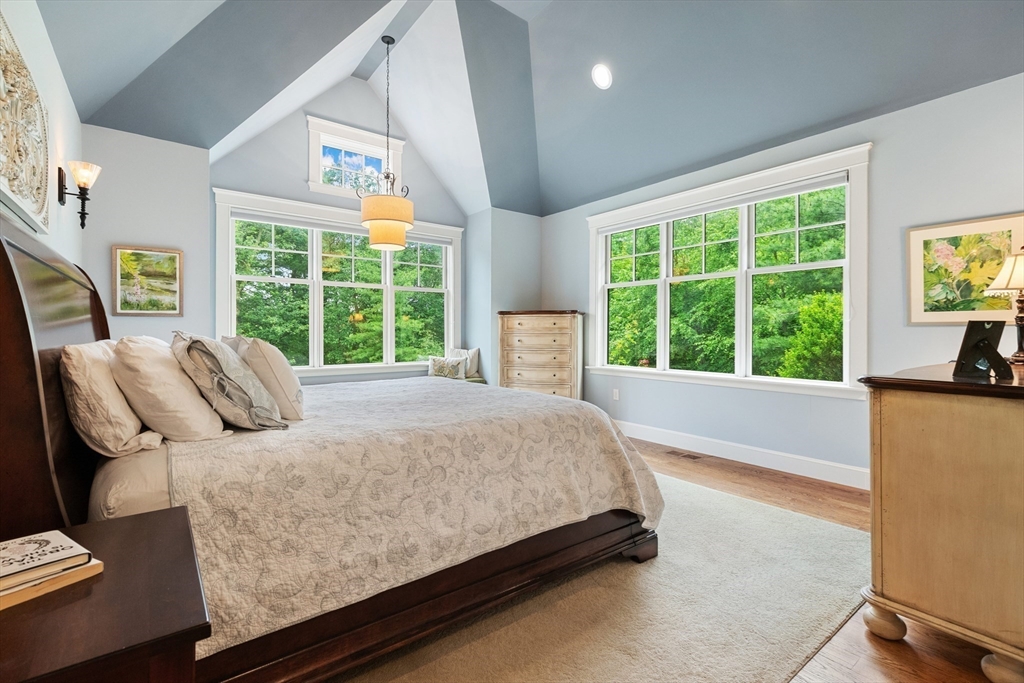 27 Whitehall Circle Beverly, MA 01915 - Photo 14 of 42 a bedroom with a bed and glass window