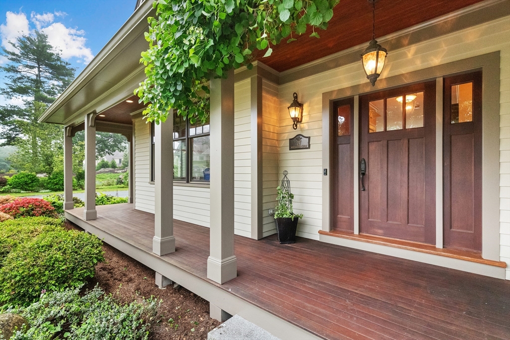 27 Whitehall Circle Beverly, MA 01915 - Photo 2 of 42 a porch with seating space and hardwood floor