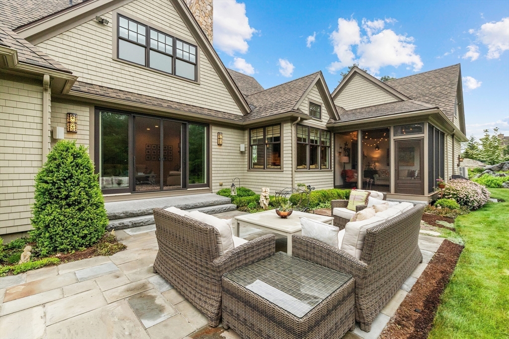 27 Whitehall Circle Beverly, MA 01915 - Photo 24 of 42 front view of a house with a garden