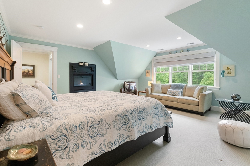 27 Whitehall Circle Beverly, MA 01915 - Photo 27 of 42 a bedroom with a large bed and a couch
