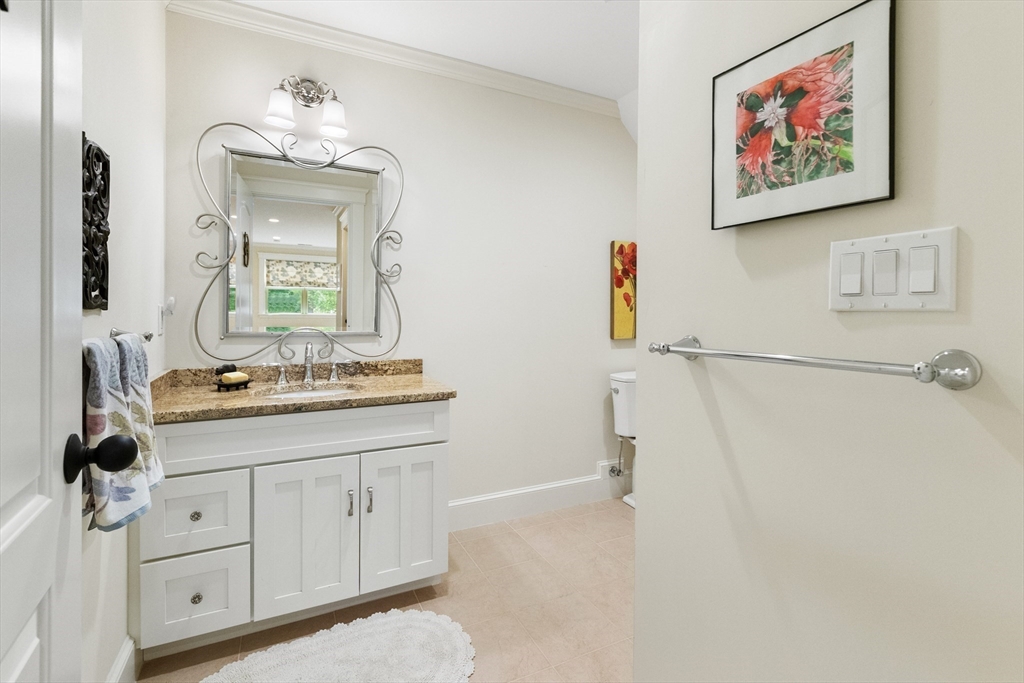 27 Whitehall Circle Beverly, MA 01915 - Photo 30 of 42 a bathroom with a double vanity sink and a mirror