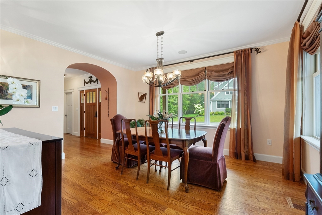 27 Whitehall Circle Beverly, MA 01915 - Photo 3 of 42 a view of a dining room with furniture window and wooden floor