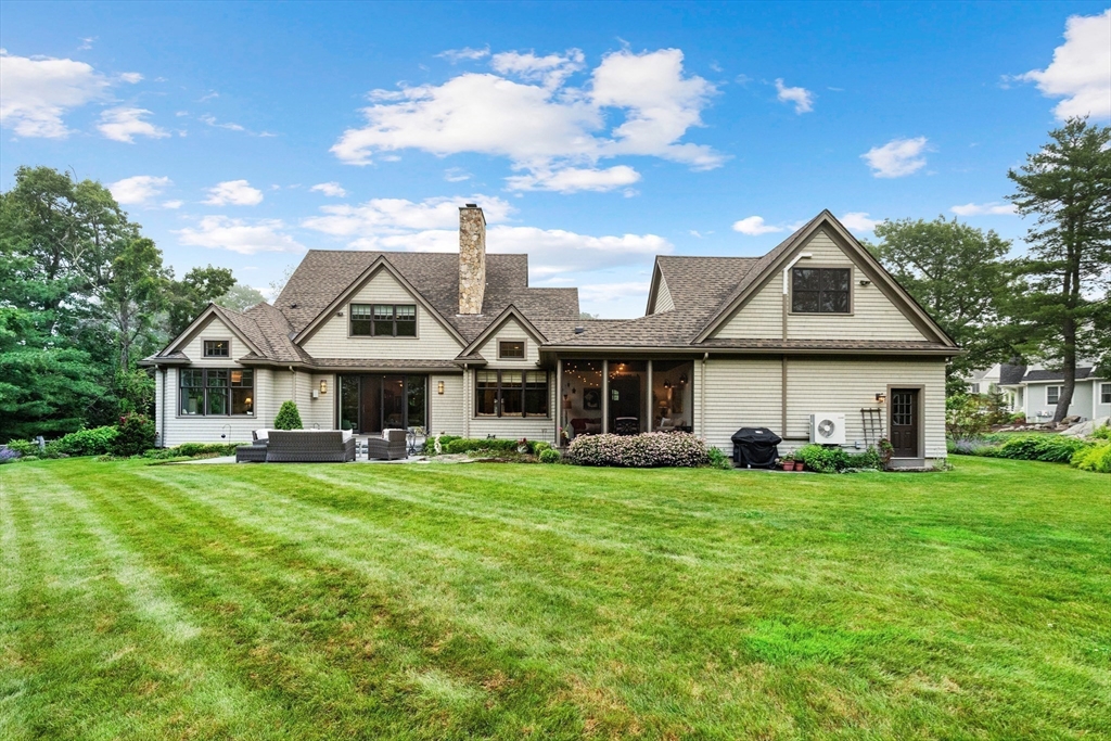 27 Whitehall Circle Beverly, MA 01915 - Photo 33 of 42 a front view of a house with a garden