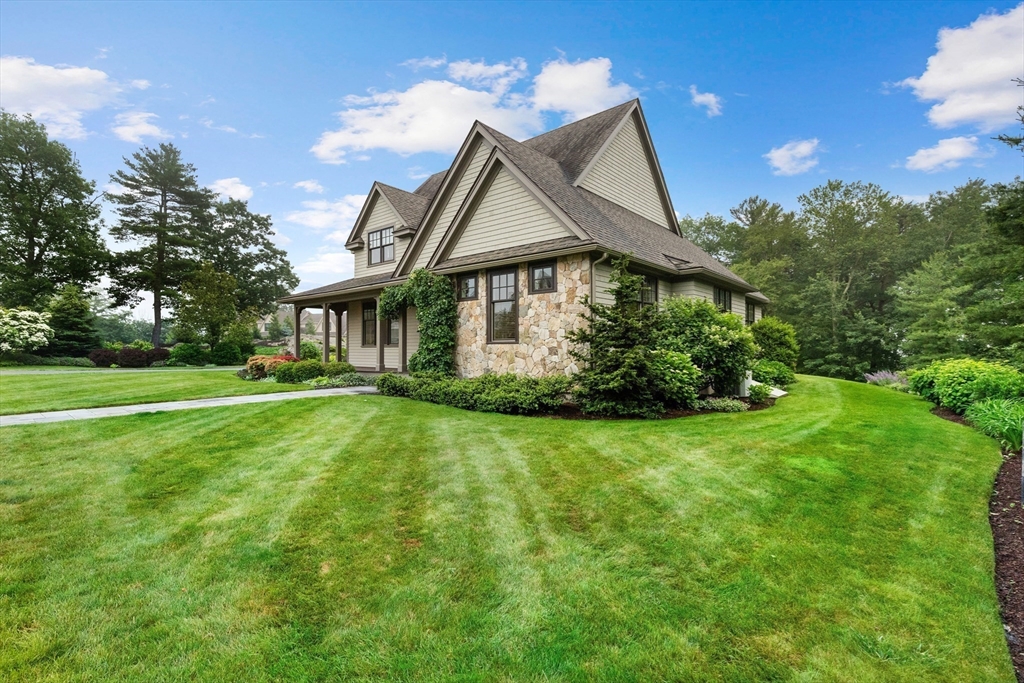 27 Whitehall Circle Beverly, MA 01915 - Photo 34 of 42 a front view of a house with garden